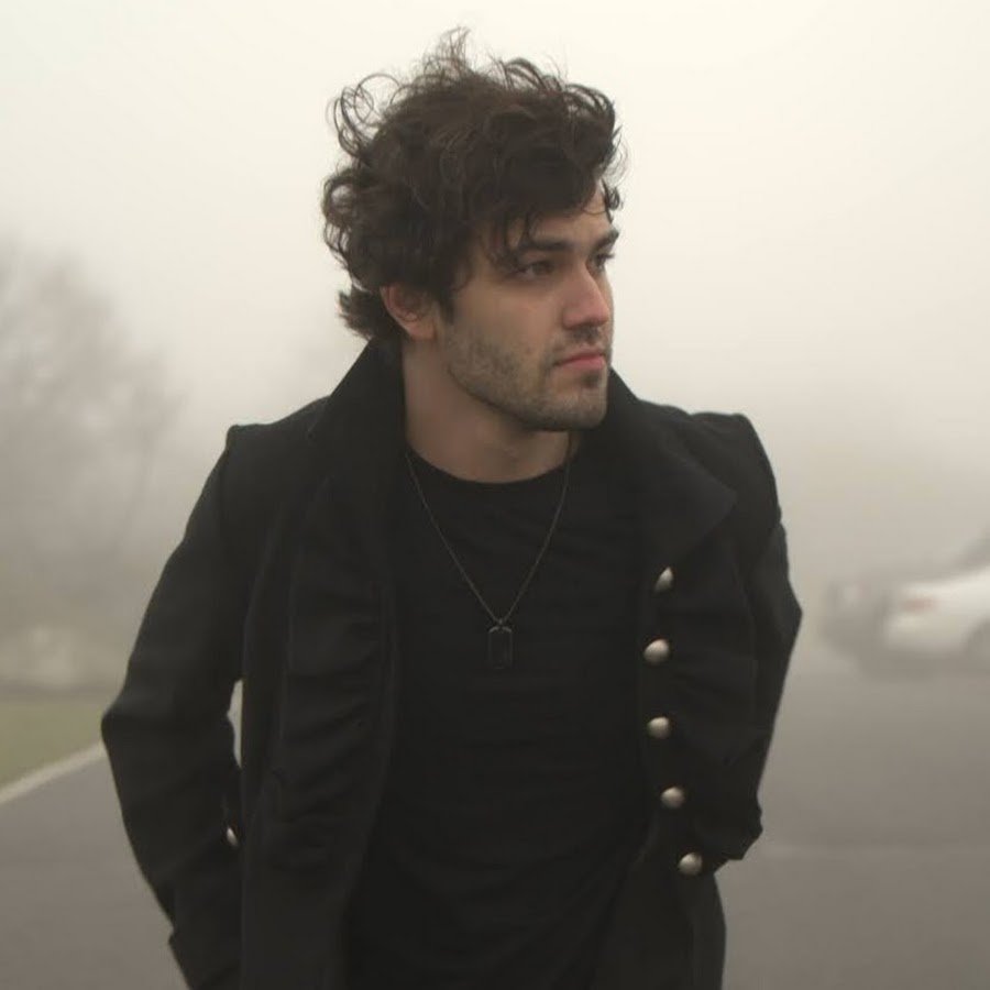 Blake McLain close portrait in fog, black coat